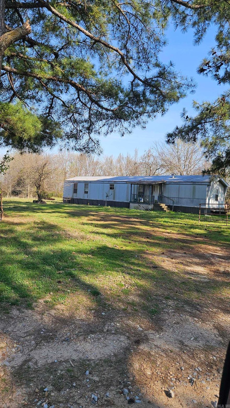 Great property 18 acres at the Edge of Town with a 2 bed 2 bath trailer and concrete floored shop.