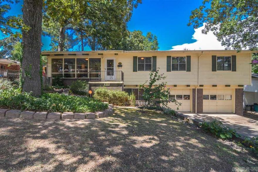 Spacious contemporary home, living room w/ ceiling to floor windows. Huge kitchen w/ dining, breakfast bar, new Corian counters. Refinished hardwoods, some new paint and fixtures, new carpet, remodeled hall bathroom, Corian counter in master bath, new roof – 2014/2015. Large fully fenced backyard.  Drive through garage and workshop in garage that’s 348 sqft. of heated & cooled space not included in total square feet.  Also includes a man’s half bathroom.  Washer/Dryer hook ups on main level and in garage.