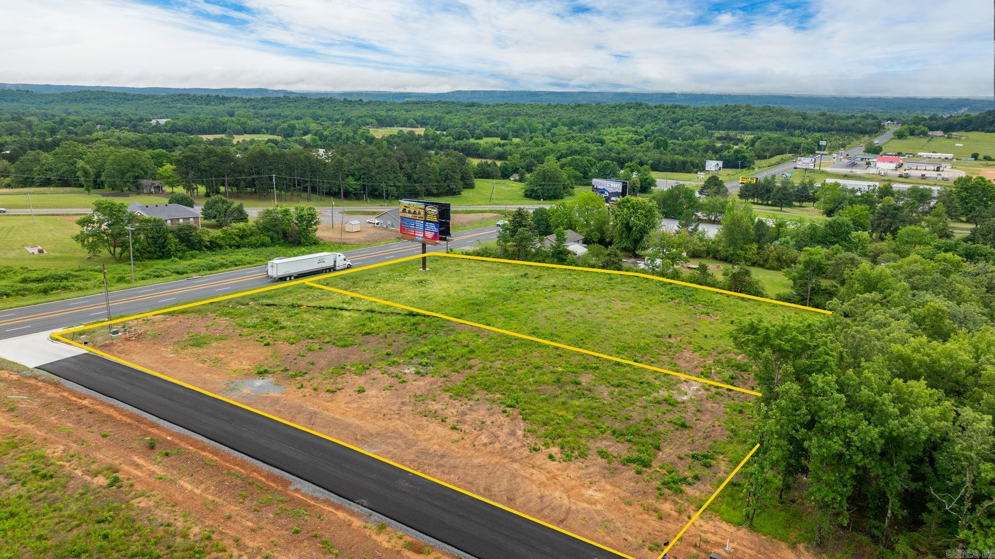 High Visibility location on Hwy 65 with a high traffic count. One acre parcels available that could be combined for up to 3 acres together. 6 acres total commercial land available. Sky Eagle Drive divides the two 3 acre parcels. Outside of the city limits with no restrictions. Property is cleared and ready to build