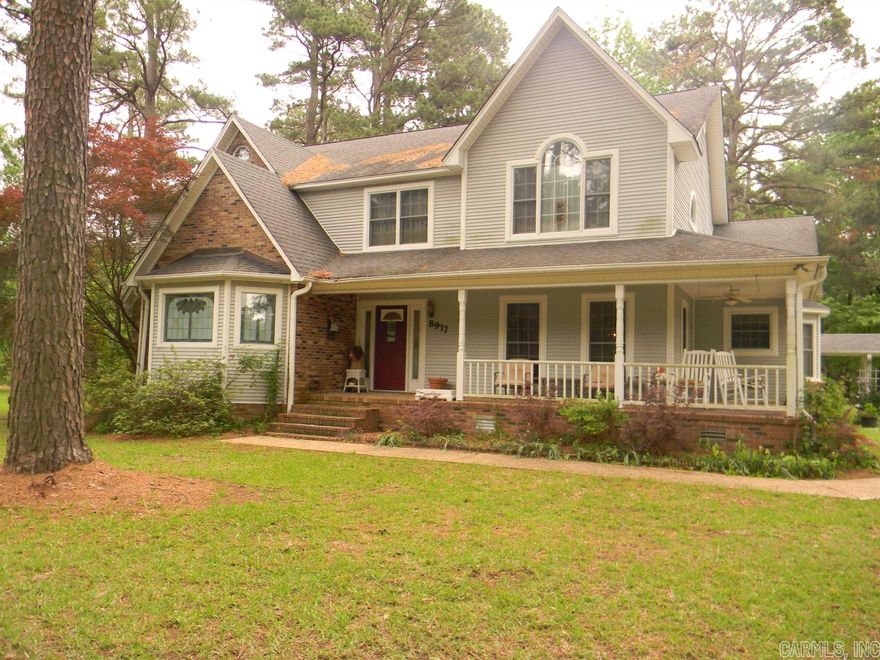 This is a custom-built home with solid oak cabinetry in the kitchen, great room and bathrooms.  An oak staircase leads to two large bedrooms upstairs, each with their own bathroom, large closet and easy access to floored attic space.  The kitchen has much to offer with large walk-in pantry, lots of storage in the island that easily seats four.  The lower cabinets all have easy pull drawers to keep bake ware at your fingertips.  Two-way lighting is throughout the home.  The main floor also has a formal dining room, great room, large kitchen, laundry room, sunroom and main bedroom and two baths.  Two separate heat & air units as well as water heaters, wood burning, site built fireplace in the great room, gas log fireplace in the main bedroom which also has a very spacious bathroom that has recently been updated.  A sunroom that offers a serene place to enjoy your favorite book or just take in nature that surrounds the home. All window coverings/blinds will remain.   If you enjoy being outdoors, you will certainly enjoy the front and back porch.  Parking is no problem with the 4 car detached garage and portable canopy.  Stately pine trees adorn the property on this corner lot.