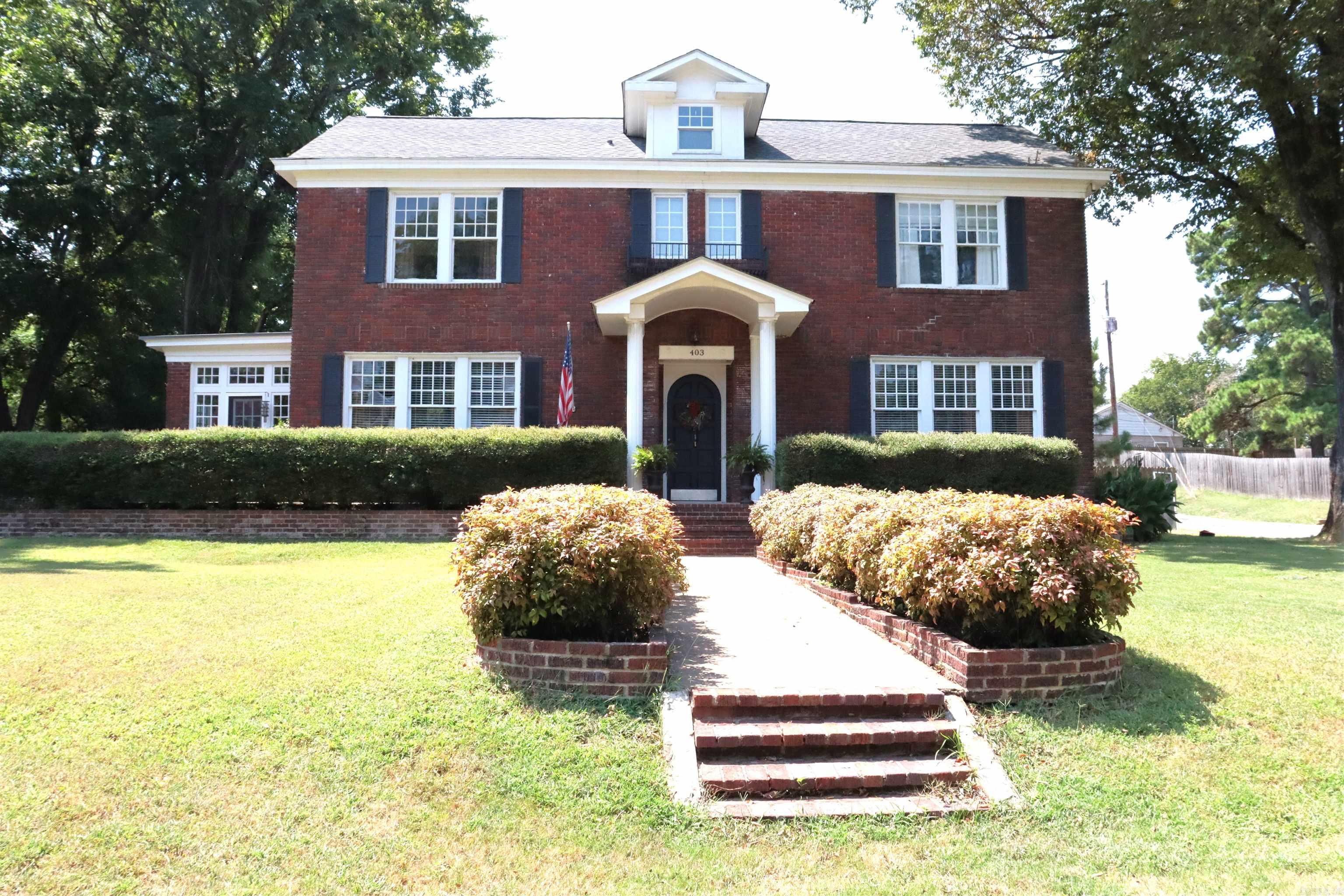 This Historic Colonial Revival treasure, the Irving House, built in 1926 and listed on the National Register of Historic Places. This remarkable home blends rich architectural details with thoughtful modern updates, creating a warm and inviting space filled with character. A gracious foyer welcomes you into the home, leading to a formal dining room and a spacious living room anchored by a charming fireplace. Sunlight pours into the bright sunroom, while a cozy home office with its own fireplace offers the perfect space for work or reading. The eat-in kitchen provides a comfortable setting for everyday meals and entertaining. Upstairs, youāll find three bedrooms and two bathrooms, including a large walk-in closet that adds modern convenience to historic charm. Recent updates: HVAC system (2016) Water heater & dishwasher (2018) Gas stove top (2023) New roof (2019) Solar panels (2020) Updated plumbing (2023). The property also features a detached two-car garage and an unfinished mother-in-law suite, man cave, or hobby room that is ready to be transformed. From the preserved historic character to the upgraded systems, this home offers a unique opportunity to own a piece of history.