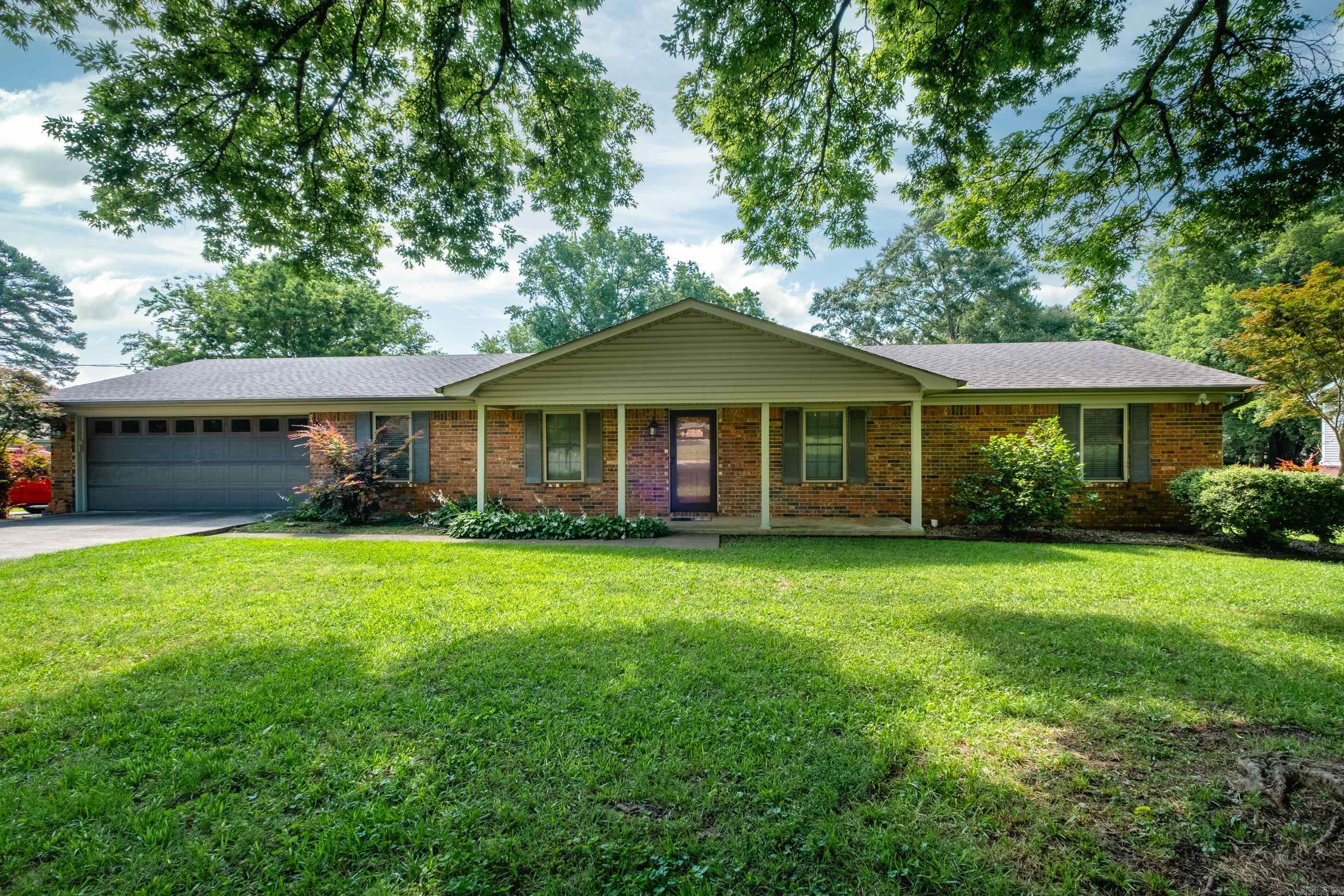 Located in a highly desirable subdivision, this immaculate and well-maintained home offers the perfect mix of comfort and convenience. Featuring beautiful pre-finished hand-scraped hardwood floors and generously sized bedrooms, this home is move-in ready. Enjoy the warmth of a cozy fireplace and the charm of a country feel—right in the heart of the city. The property includes a heated and cooled shop with a single garage door, ideal for projects or additional storage. A spacious deck provides the perfect space for entertaining, and the fully fenced backyard offers privacy and room to play. Centrally located in the town of Benton, this home truly has it all!