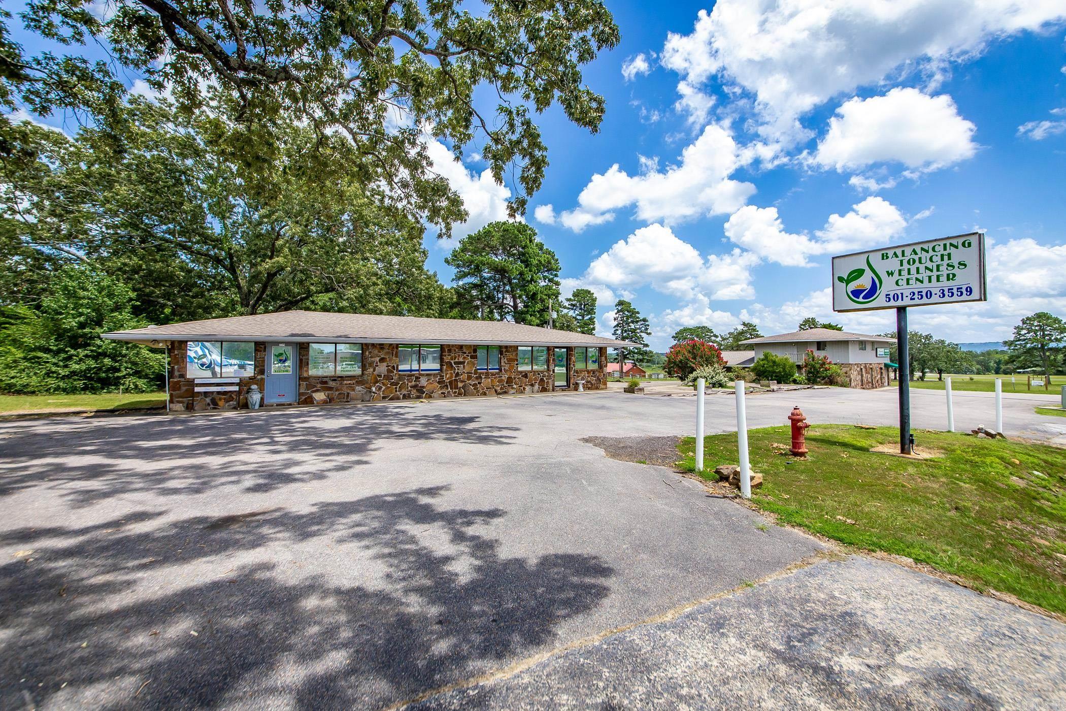 This is a great opportunity for a Business right in the "heart of Greers Ferry". This land already has an existing building with a business leasing it. The land has room for several types of businesses. At one time there was a working Carwash located on the property so there is plenty of space for another one, or in the back of the land even a small RV Storage or even several Food Trucks to keep the vacationers able to have a variety of small restaurants. Lot of options and many opportunities await. Take a tour and get started on your new business today. ( The two story Chiropractic Clinic is not included in this sale. )