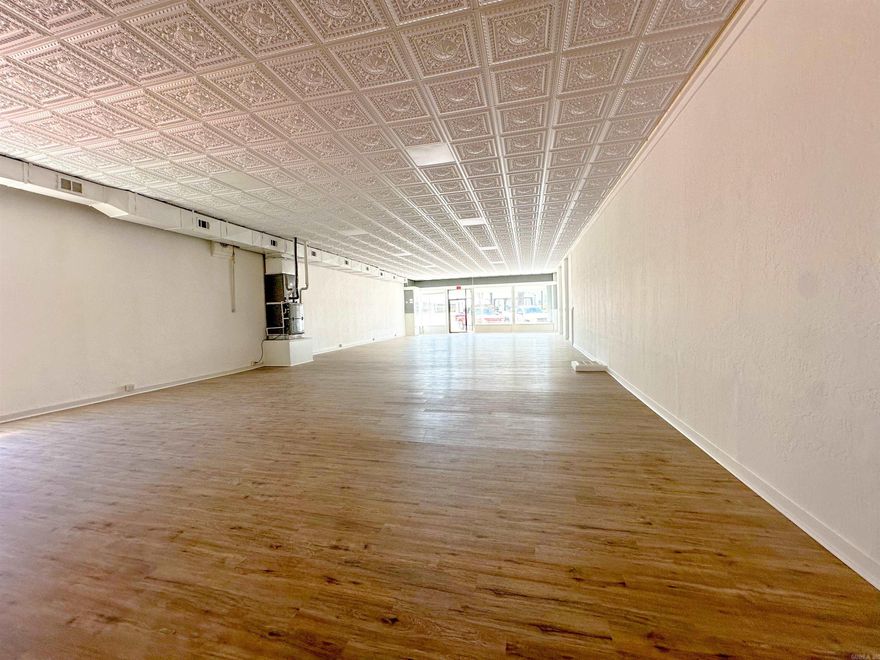 Own a piece of Berryville history! This iconic commercial building sits on the town square and offers over 14,000 sq ft of space. Originally built in 1900, it features classic architectural charm with modern upgrades. A one-bedroom, one-bath apartment was added in 2021—ideal for an on-site manager, rental income, or Airbnb. With its prime location and visibility, the building offers endless potential for retail, office, event space, or mixed-use development. Whether you’re an investor or entrepreneur, this property presents a rare opportunity to make your mark in the heart of Berryville. Zoned commercial and full of character, it’s perfect for those looking to restore, reimagine, or repurpose a historic property.