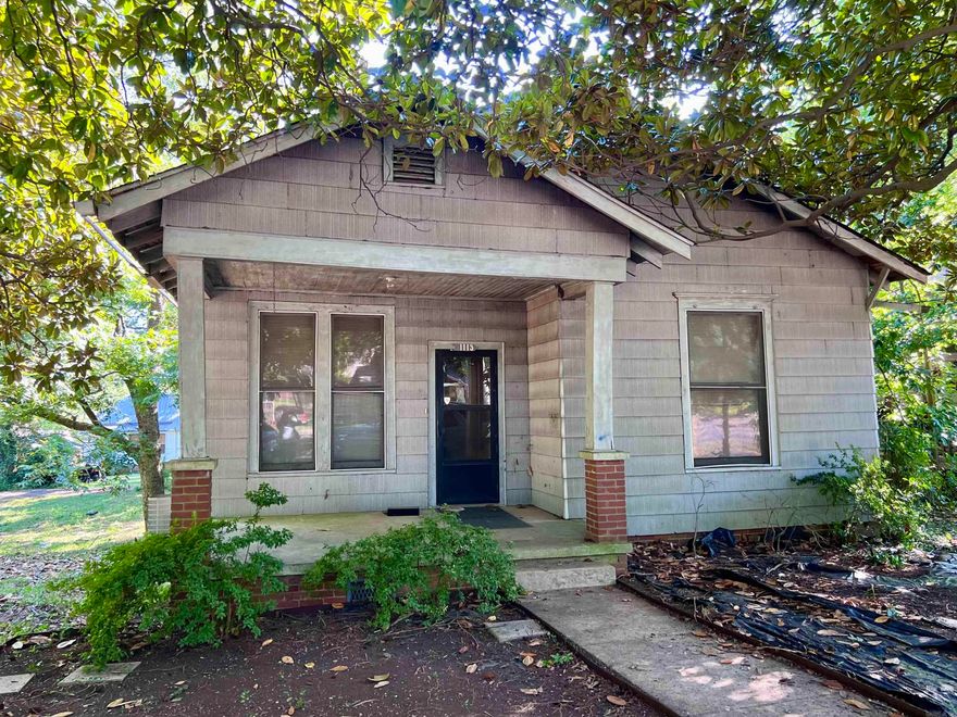 Zoned BOTH COMMERCIAL & RESIDENTIAL!!!!!!!    This 3-bedroom, 1-bath home may need a bit more than your standard TLC—think new roof, HVAC, and a solid cleanup—but the potential here is undeniable! With its charming curb appeal and prime location on a spacious double lot, this property offers plenty of room to create the home or investment you’ve been envisioning.  Power is currently off, but once brought back to life, this one could truly shine. A great opportunity for investors, flippers, or anyone ready to roll up their sleeves and bring out the best in this hidden gem.  If you are looking at this for a business there would be plenty of space for parking if you wanted to use the side lot!