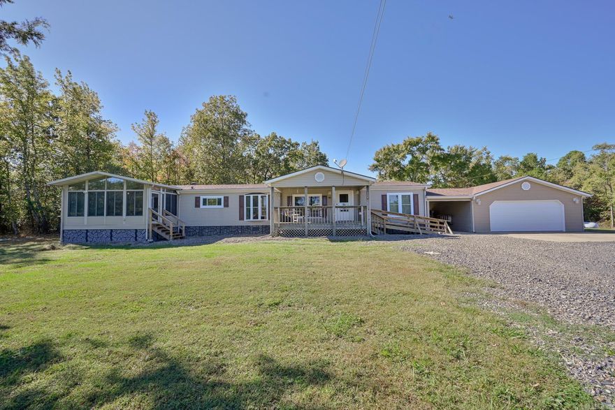 Country Living Close to Town –  Home #1- 4B/2B 2280 sq ft, #2- 2/B 2/B 896 sq ft. Enjoy peaceful living on the outskirts of Mena city limits with two immaculate homes on one property — perfect for extended family, guests, or rental income! Features include: New roof, windows, and flooring, and much more – move-in ready! Home #1 has TWO en suites! RV hookup for guests or travel convenience. Multiple outbuildings and carports for storage, workshop, or hobbies. Storm shelter near both homes. Partially fenced yard and partially wooded acreage for privacy. Garden spot ready for your next harvest. Enjoy the abundant wildlife right at your back door. Very close to the Rich Mountain Bike Trail System — ideal for outdoor enthusiasts! This property offers the perfect balance of country charm and modern updates, with space to spread out and room for everyone. Will this be your forever home or will it be an investment property? Options are endless.  Just minutes from downtown Mena – schedule your showing today and start living the good life! Additional adjoining 8 acres for purchase MLS #