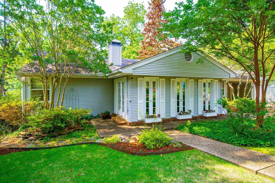 Fabulous 1956 Traditional located in one of the most beautiful streets in Paschal Heights. Large windows overlooking front and back gardens offering extensive natural light. Original hardwood floors, open entry to Family Room, Dining and Breakfast Room. Kitchen with stainless steel appliances, natural light and open to deck for easy outdoor cooking. Main level has split floor plan with 2 bedrooms sharing hall bath and 3rd bedroom with private bath. Main Bedroom & bath located on lower level with 2nd fireplace, ex-large bath, walk in closet and private deck. Lower level also comes with a 2nd family room, wet bar, laundry and 4th bath. All have access to 3rd deck and landscaped backyard. Fenced backyard with walking paths thru amazing gardens with sprinkler system, front and back. (Items that DO NOT convey: washer/dryer/fridge/DR Light & Drapes andMain Bath hanging light) Located in Jefferson Elementary School Dist.