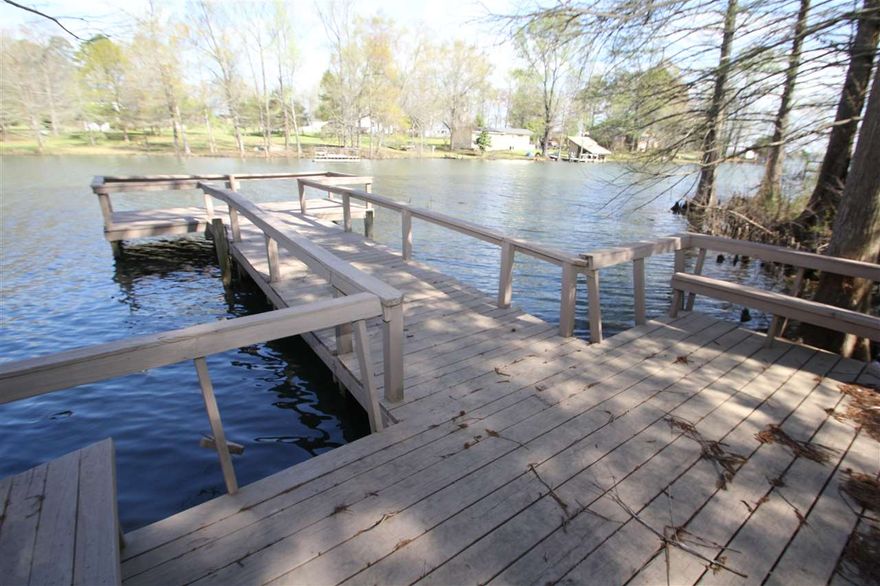 150' of waterfront, 8x16 dock with 8x13 deck.  3 bed/2bath, 1668 sf home.  Built-in 2-car garage is deep enough to store boat or could be used as workshop/storage space. Washer/dryer and furniture conveys with property.