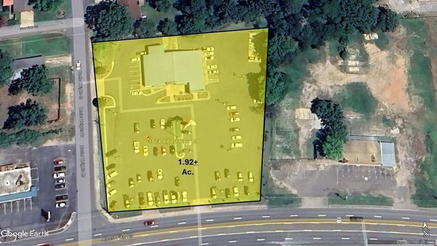 Level 1.9 acre lot along busy Albert Pike corridor w 225 ft frontage and 18,000+/- daily traffic count. 7,200+/- sf showroom and offices. If your business needs open display, retail and office space this property has it all. Current Tenant will relocate. NOTE TO PUBLIC Please do not approach Tenant or employees, call Listing agent.