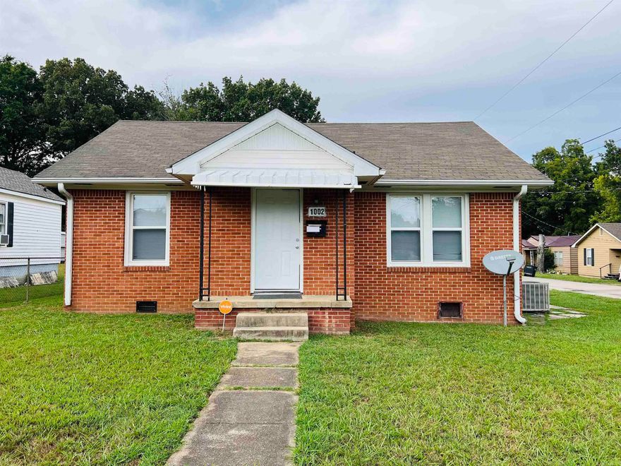 Great starter home or investment property.  This brick home features 3 bedroom, 1.5 baths, beautiful original hardwood flooring, a single garage and it is located on a corner lot. Recent updates include new windows, gutters, and new appliances.  The property is sold AS IS and no seller property disclosure will be provided.   Call or text today to take a tour!