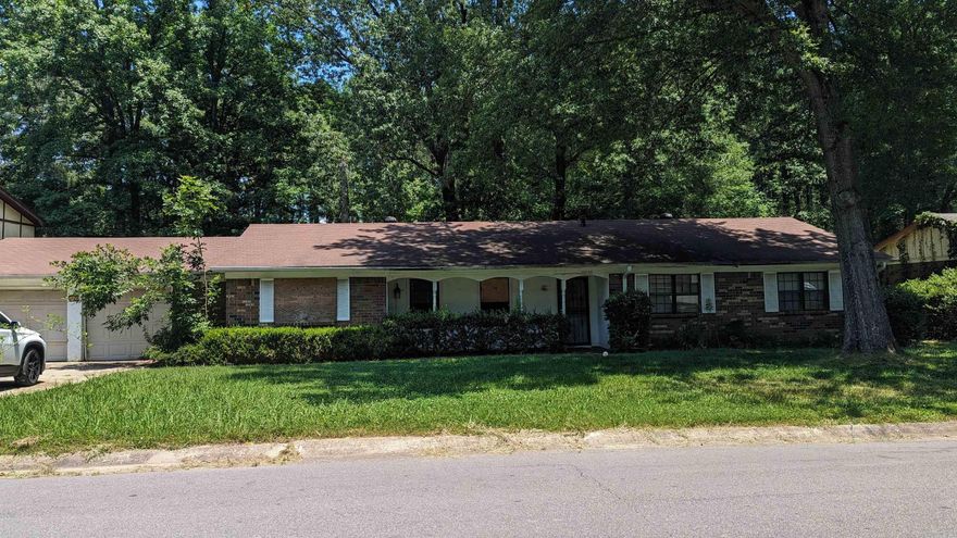 Could be a beautiful home with some TLC. Located on a large lot with a bonus building in the back. Large formal living room, large den with fireplace.
