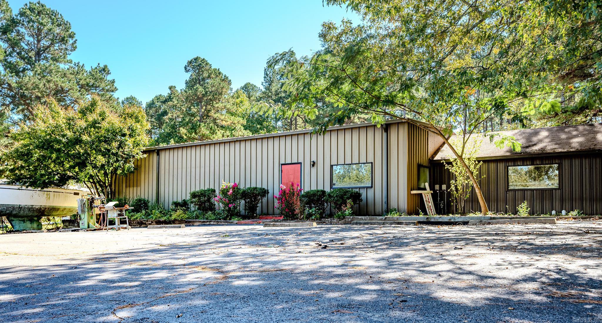 This Building and Land is ready to start your own Business! Great Location with lots of area (4.30 acres m/l) and Square Footage! The building runs on Natural gas, is equipped with 3 phase/220 electrical. There is a Lift that will convey with the property as well and a 25hp compressor! It is on septic, and has a DEEP well. Owner has newly remodeled the kitchen with adjoining bathroom (brand new water heater!) and pantry. This Business could be livable with all the upgrades and adjoining separate living space. New paint on all the interior walls! This is a diamond in the rough opportunity for the right person! Owner Financing available with approved credit. (see agent remarks for additional financing information). The 4.30 acres allows the Owner to have many options for different Businesses!