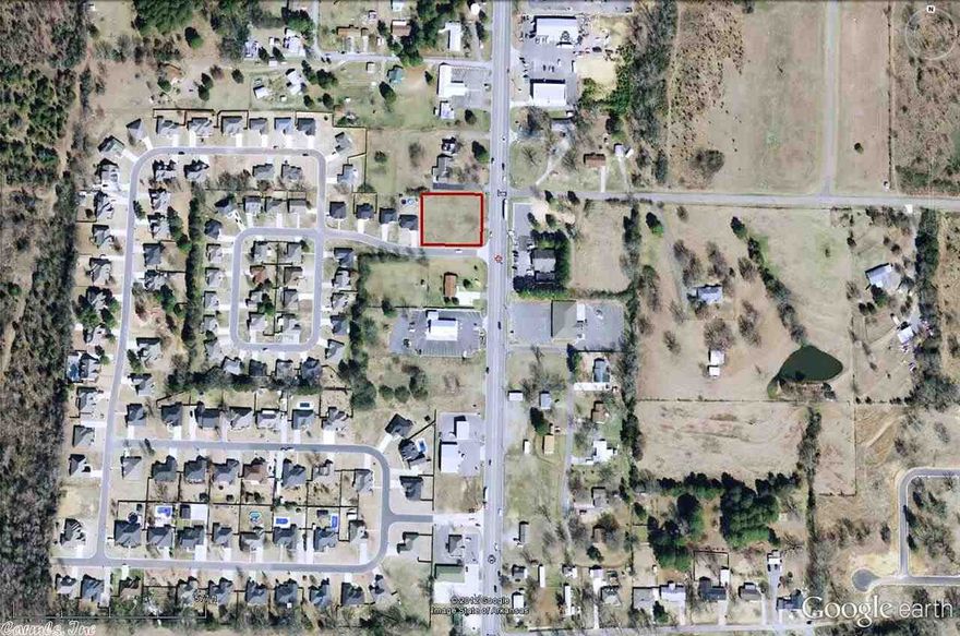 Over a half acre lot situated at the entrance of the North Hills Subdivision is now available for commercial development.  Prime corner lot on Highway 65, zoned C-2.  Will be a good location for any business needing high traffic, high visibility.  Fast food, service, quiet office, etc.  Offers 150' highway frontage and 175' frontage on North Hills Drive.  Easy access property.