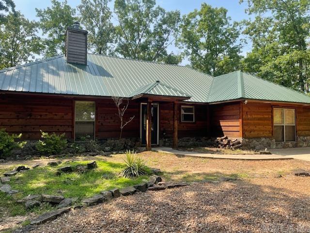 Enjoy this perfect get-a-way lake home with boat slip in the beautiful Enchanted Peninsula subdivision. The home has a comfortable cabin feel, with cozy rustic aesthetics. Nice lake view and just across the street from your slip in the community boat dock. There is an easement to allow you to take your ATV directly to your slip. It includes a well maintained hot tub to enjoy on your large back deck. 3 bedrooms and 3 full baths. Furniture negotiable. Some pictures taken below white line. It's ready for Summer 2025!