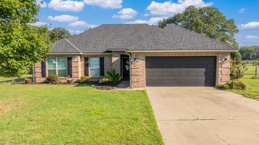 Step into this 3-bedroom, 2-bath home on approx. 1.27 acres. ARCHITECTURAL ROOF in 2024. The family room features a wood-burning fireplace, and the eat-in kitchen offers granite countertops, stainless steel appliances, and a breakfast bar. The primary suite includes its own private bath with separate tub and walk-shower. Outside, enjoy a covered patio, fully fenced backyard, storage building, and inground concrete storm shelter. With country space and privacy yet close to town, this property balances comfort and convenience.