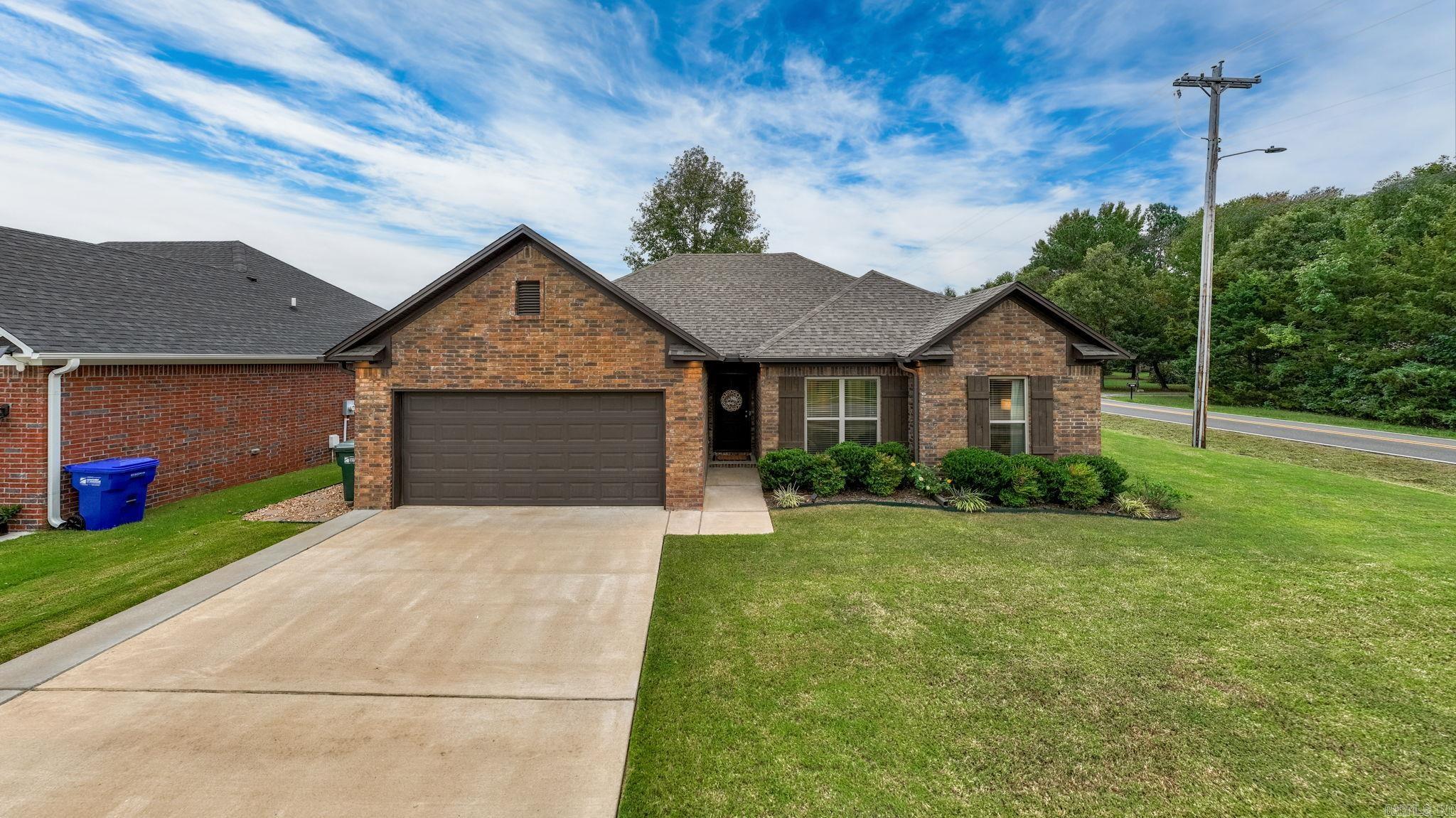 The location of this home is fantastic. You can be to the Interstate in minutes. The backyard is fully fenced and huge. The corner lot is the largest lot on the street. The covered patio is so nicely done and will be a refuge at the end of the day. The interior of the home is equally inviting. The living room is spacious and is open to the kitchen and dining area. The bar offers extra seating space. There is no carpet in the home and the no fuss concrete floors make for easy cleaning. The guest bedrooms are separate from the primary bedroom. The laundry room has a door that opens to the primary closet which you can walk through to get to the primary bedroom. The primary closet is oversized. There are many can't miss features in this beautiful home!