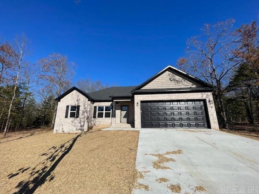 New construction home on 1 acre lot with woods. Private backyard.  Luxury vinyl throughout. Soft painted gray cabinetry with white quartz countertops. Quiet dead end street convenient to Hwy 65 in the Greenbrier school district.