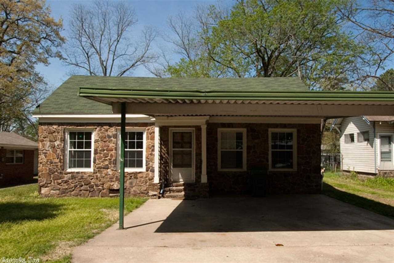 A rock home was used as a day care center. This 3 Bedroom 2 bath home also has an office in 1672 sq.ft. Features include a large living area, two car carport and storm shelter. Large pantry.