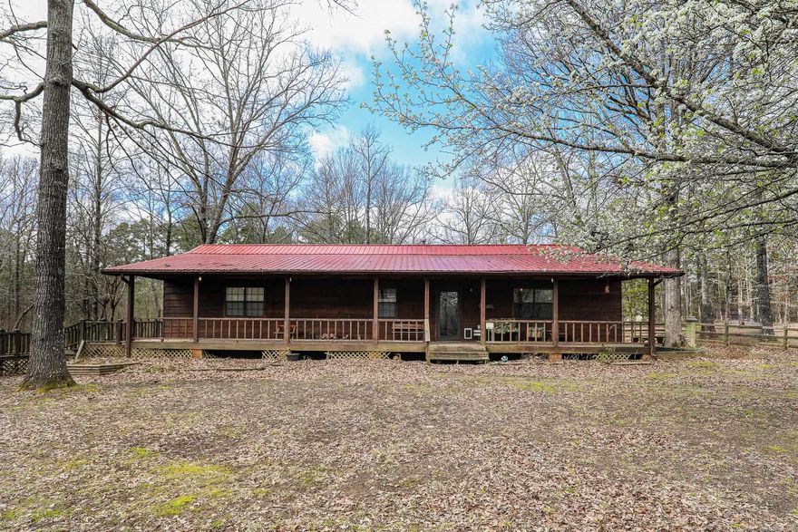 3 bedroom 2 bath home sitting on over 7 acres.  2 shop buildings, plus extra storage building.  Home updated  in recent years.  Updated kitchen, bathrooms, flooring , light fixtures, appliances  and paint. Large wrap around porch, decking nice place to sit back and relax! Whole home generator never be without power!