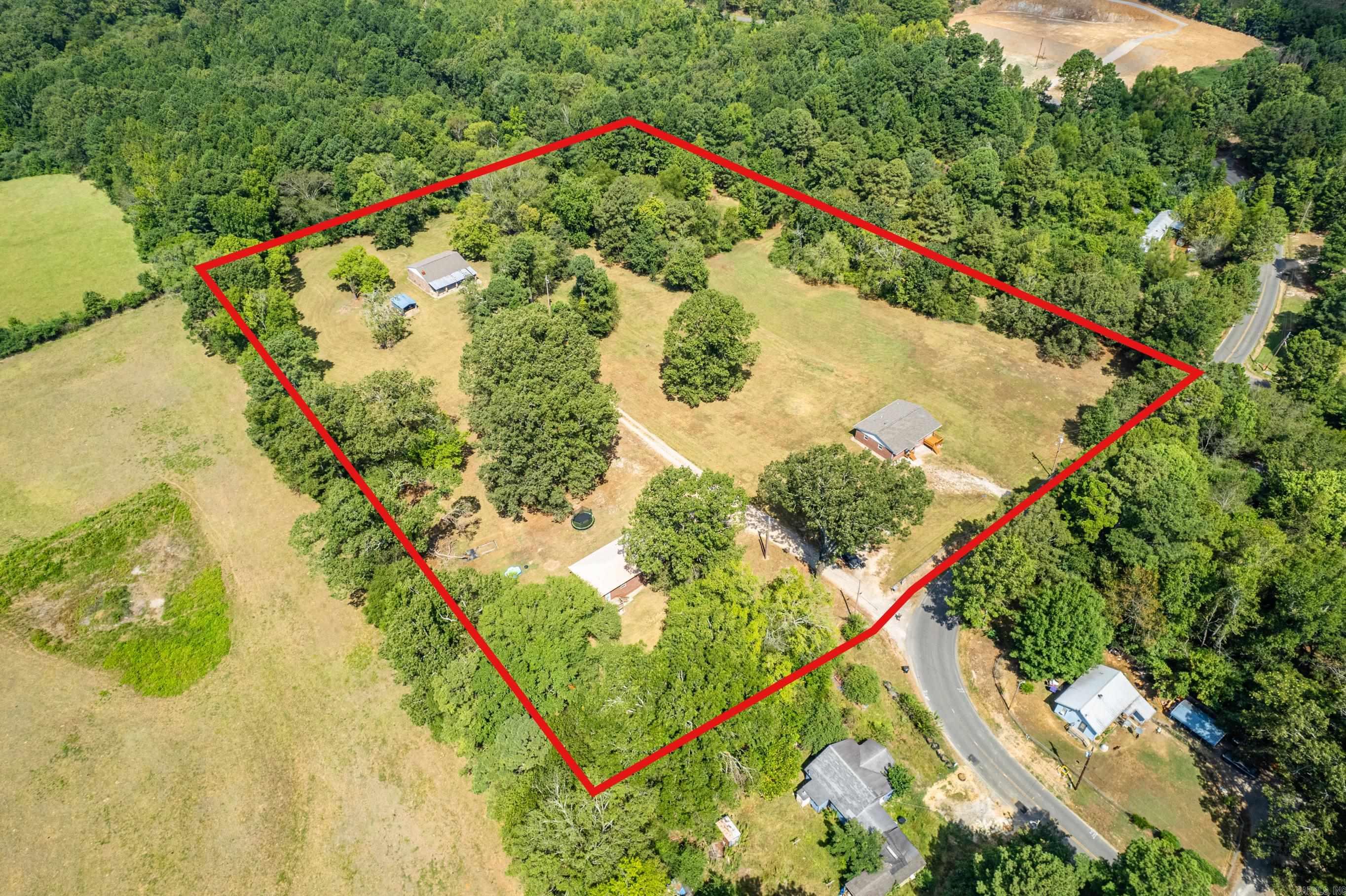 3 homes on over 7 1/2 acres! Beautiful country setting in Lake Hamilton School District. Live in one of the homes and lease the other two. Plenty of room to build more homes. Mobile homes are allowed. Lots of options! Currently, all three are leased. Two - 3/2 One - 2/2.ATTENTION INVESTORS-GREAT PROPERTY TO ADD TO YOUR PORTFOLIO! First home on the right 3/2 has been remodeled. New Roof(replaced decking as well), New HVAC, gas heat(natural gas) electric cool, New cabinets in kitchen and bathrooms, new kitchen countertops, replaced windows and doors. New carpet in one room. The 2nd home 3/2 all electric(new roof) and third home is 2/2 all electric.