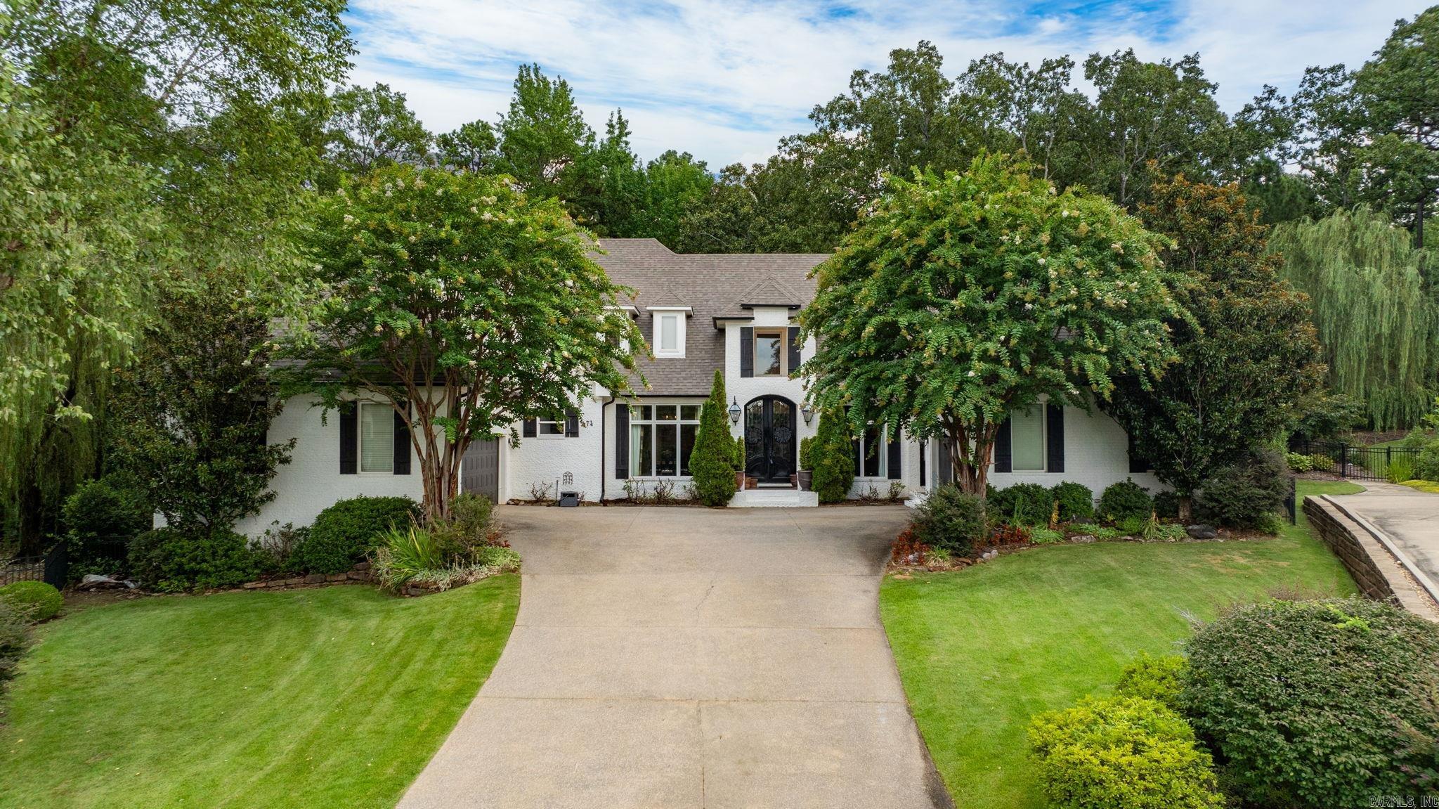 Beautiful Home in The Arbors of Chenal Valley on quiet cul-de-sac. Spectacular floor plan for family living and entertaining. Beautiful banquet sized formal dining and handsome study. Fabulous family living room, wonderful gourmet kitchen with large island and breakfast area. Wet bar. Separate home office. Spacious primary suite on the main level with luxurious bath. Full guest bedroom suite on the main level perfect for nursery. Upstairs: two large bedrooms and two bath along with playroom and media room! 3 car garage. Nice back yard with sun deck and separate outdoor covered terrace with fireplace, perfect for fall cookouts and stone water feature. Wonderful yard with lush landscape. Excellent location easy walking distance to Chenal Country Club. Gated neighborhood.