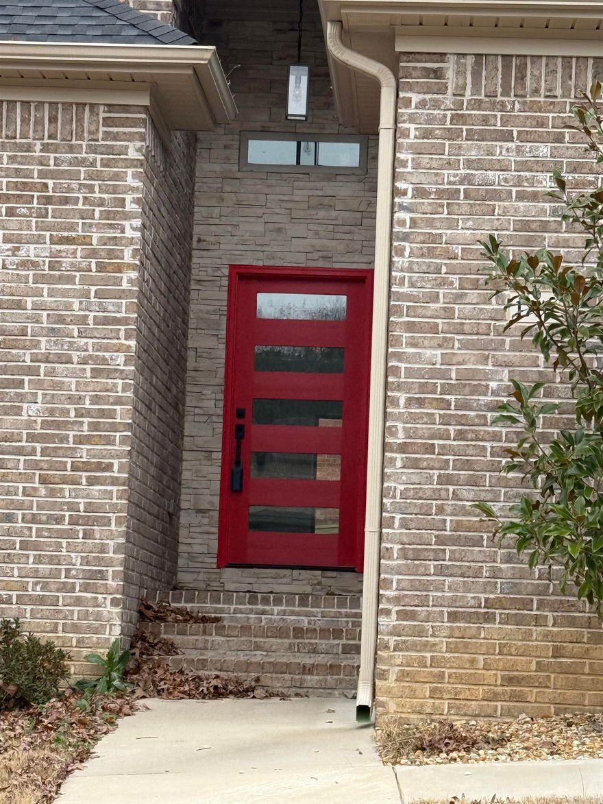 Welcome to Kanis Village – This newly constructed corner lot home offers an impressive blend of modern elegance and practical living. 2,049 sq ft, this 4-bedroom, 2-bathroom masterpiece is designed with an elevated open concept. As you enter, the foyer greets you with a warm, contemporary ambiance that sets the tone for the rest of the home. Off the entrance, the state-of-the-art kitchen dazzles with granite counter top, built-in cabinetry, and sleek stainless steel gas appliances. Smart design elements like pop-up outlets equipped with USB and HDMI ports ensure modern convenience. Natural light flows effortlessly from the kitchen into the living area, centered around a cozy fireplace, perfect for relaxation. The primary suite is your personal oasis, boasting exquisite hardware and lighting, a separate waterfall shower, a deep soaking tub, and a double vanity. Luxury Vinyl and Porcelain Tile Flooring add a sophisticated touch throughout the home. The utility room, along with the secondary bath and bedrooms, are equally impressive, offering functionality and stunning design. Automated sprinkler system. This home is a true showpiece. Ask about Seller concession. 1 yr Builder Warranty