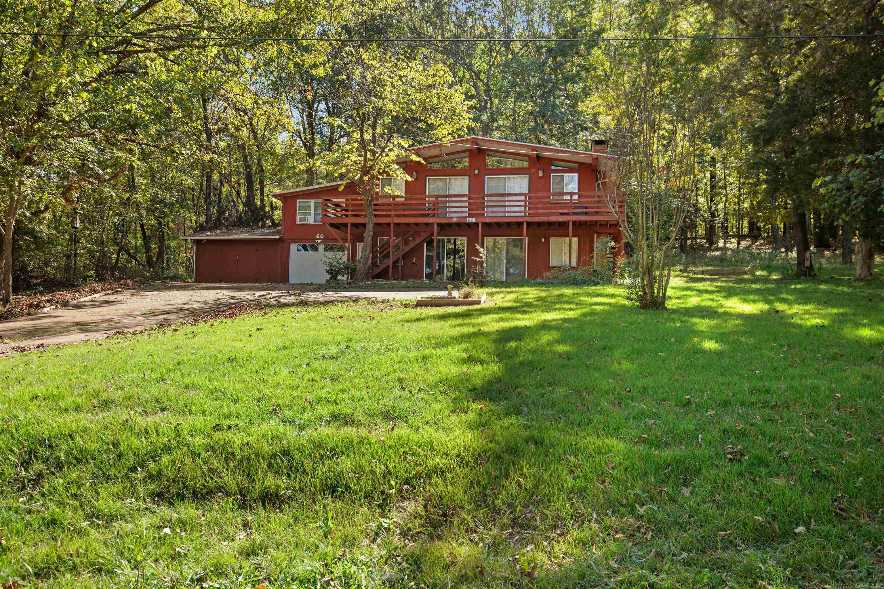 Location, Location, Location!Just a few short steps from the beautiful South Fork River where you can fish, kayak, float, or simply relax and take in the peaceful scenery. From your front door, you can see the North Golf Course—hop on your golf cart and ride over for a day on the greens! This charming home is currently being used as an Airbnb and offers both comfort and convenience in a perfect location. Step inside to a cozy living room that welcomes you with warmth and updated charm, creating an inviting space for any lifestyle. The home also features a fun game room, ideal for entertaining family and friends. Outside, you’ll love the spacious deck with amazing views—perfect for morning coffee or relaxing evenings surrounded by nature. Whether you’re looking for a vacation retreat, investment property, or full-time home, this one offers the best of Cherokee Village living! Call today for you private tour!