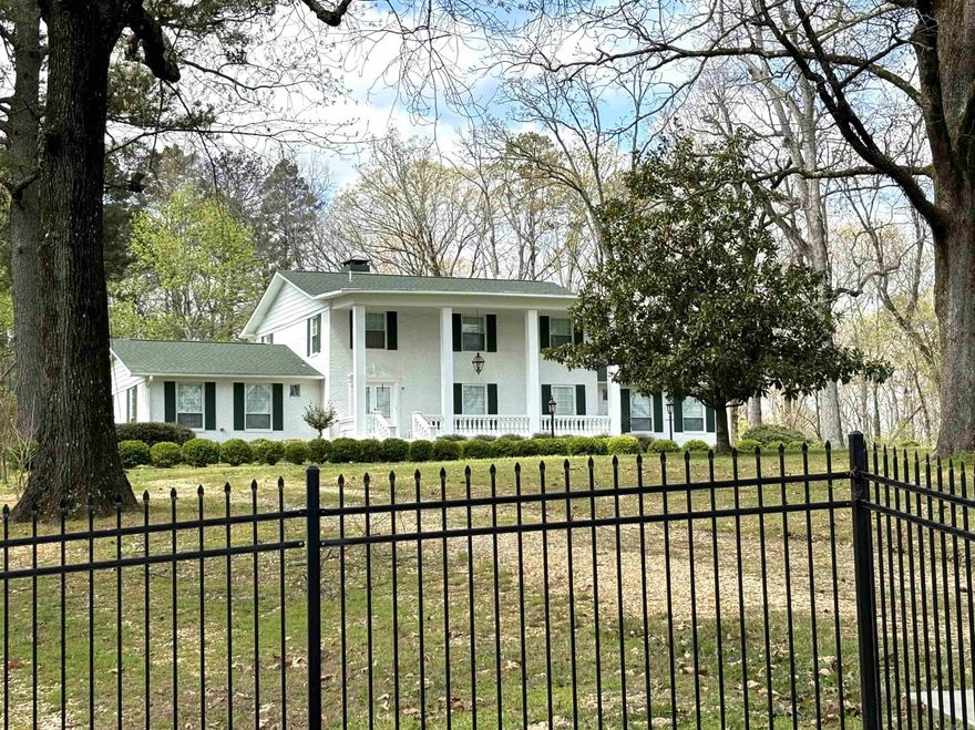 Southern Colonial beauty on 4.56 acres*full brick*multiple rooms including a living room*formal dining*hobby/office room*den*hearth room*5 bedrooms*3.5 baths*nice kitchen with ample amounts of quartz counter tops and cabinets*the kitchen and all bathrooms have been updated*water filtration system*air purification system upstairs added in 2023*roof 2021*new high quality window and doors*upstairs HVAC 2023*downstairs HVAC 5 yrs old*both water heaters around five years old*on demand generator runs the entire first floor*there are 2 bedrooms downstairs and 1.5 baths*upstairs there are 3 bedrooms with 2 full baths*all upstairs bedrooms adjoin the 2 bathrooms*2 upstairs bedrooms have sliding glass doors leading onto deck*huge laundry room*redwood columns*3 car carport*tennis court needs a little work but great for kids to play on or pickleball*wrought iron fence including three entrance gates*****There is a second home on this property that is currently being used for storage but could easily be livable again*the second home has three bedrooms and plumbed for two baths with over 2600 square feet and a newer roof and is under termite contract***Buyers must be pre-qualified before showing*