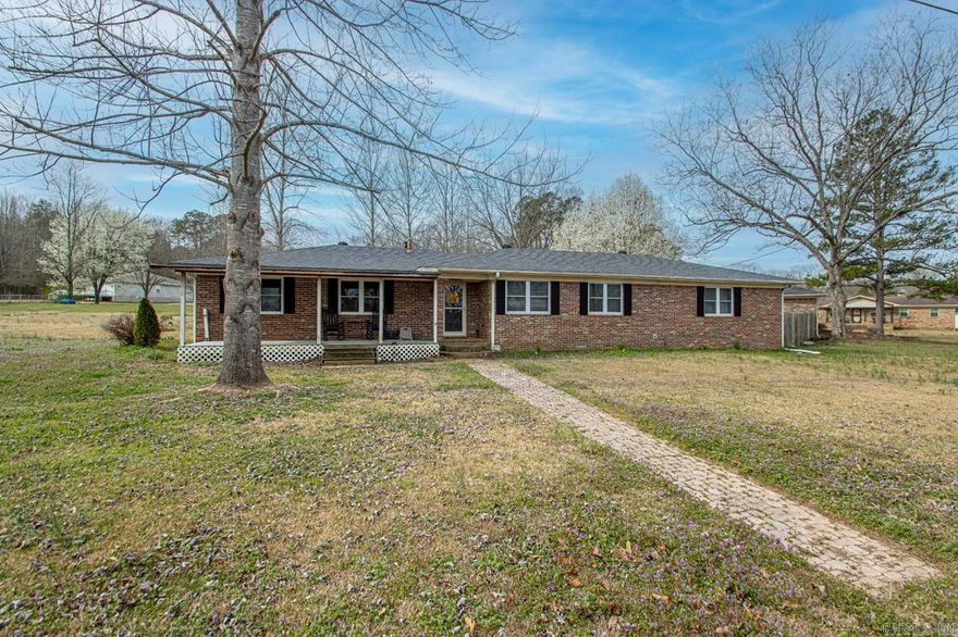 A wonderful home!  The updates and amenities such as the tankless water heater, large Composite deck, Private office in detached garage make this home quite appealing.  The vinyl floors and tiled walk-shower add a touch of modernity, while the detached garage and fenced-in backyard offer practicality and privacy.  It is an ideal space for both comfort and functionality.  Lot is 1.55 acres. large area perfect for spring gardening.  Only minutes from town and schools,  Office in detached garage offers 2 storage closets and 14 X 29 feet in size and has mini-split Heat and air unit.