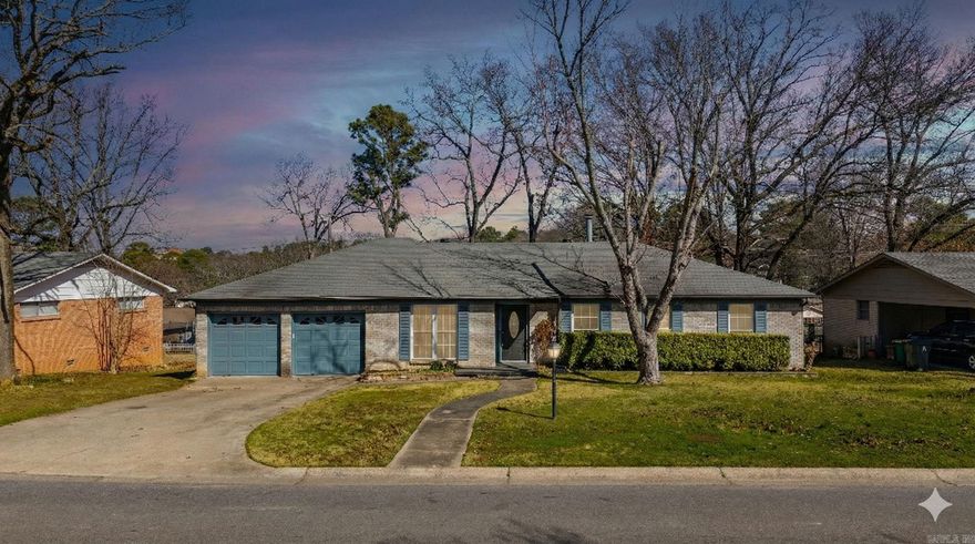 Welcome home to this beautifully refreshed property in an established Little Rock neighborhood. With fresh updates throughout and a functional layout, this home offers both comfort and versatility.  Step inside to find all-new paint, new flooring, and updated light fixtures that create a bright, modern feel. The kitchen features freshly painted cabinetry and flows easily into the living and dining areas, making it ideal for everyday living and entertaining.  The home offers multiple living spaces, providing flexibility for a second living room, home office, playroom, or media area.  The spacious primary suite includes a private bath, while two additional bedrooms and a second full bathroom offer comfort and convenience for family members or guests.  Additional features include a two-car garage, ample storage, and a layout designed for practical living.  Located just minutes from shopping, dining, parks, and major roadways, this move-in ready home combines updates, space, and convenience in one great location.