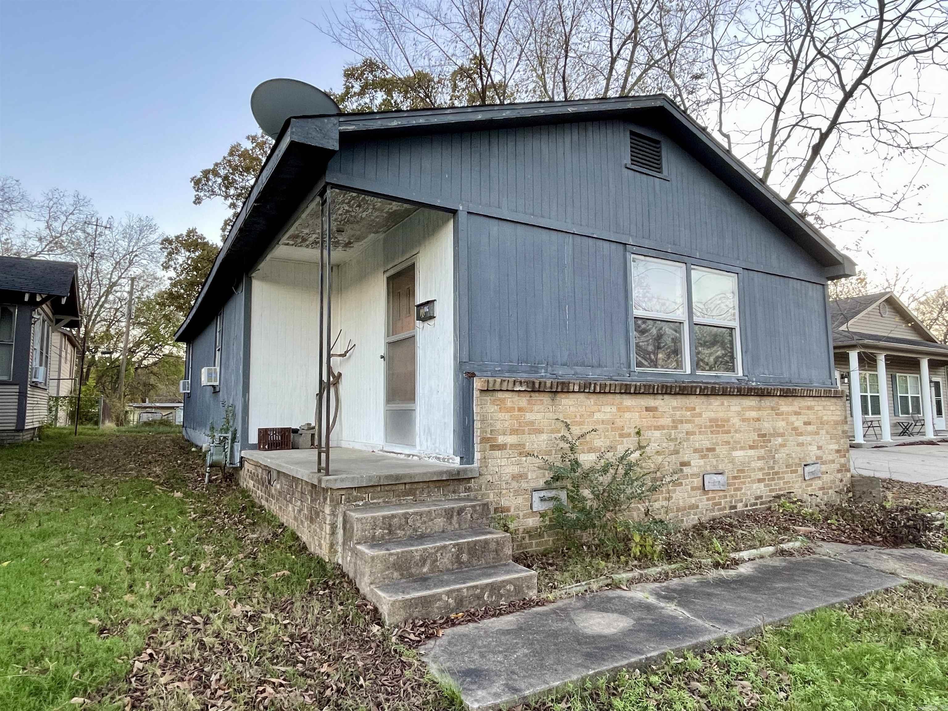 Calling all investors!!!  With a little updating this could be the cutest house on the block!!  Bath has been redone with a new surround on tub/shower and new commode.  2 bedrooms with ample closets.  Refrigerator, washer and dryer convey to buyer.  And Water Heater is only 3 years old!  And there is. working attic fan!   Don't miss this great deal to live in or rent!  NOTE: Seller is in process of moving everything out.  At that point new inside pics will will be done.