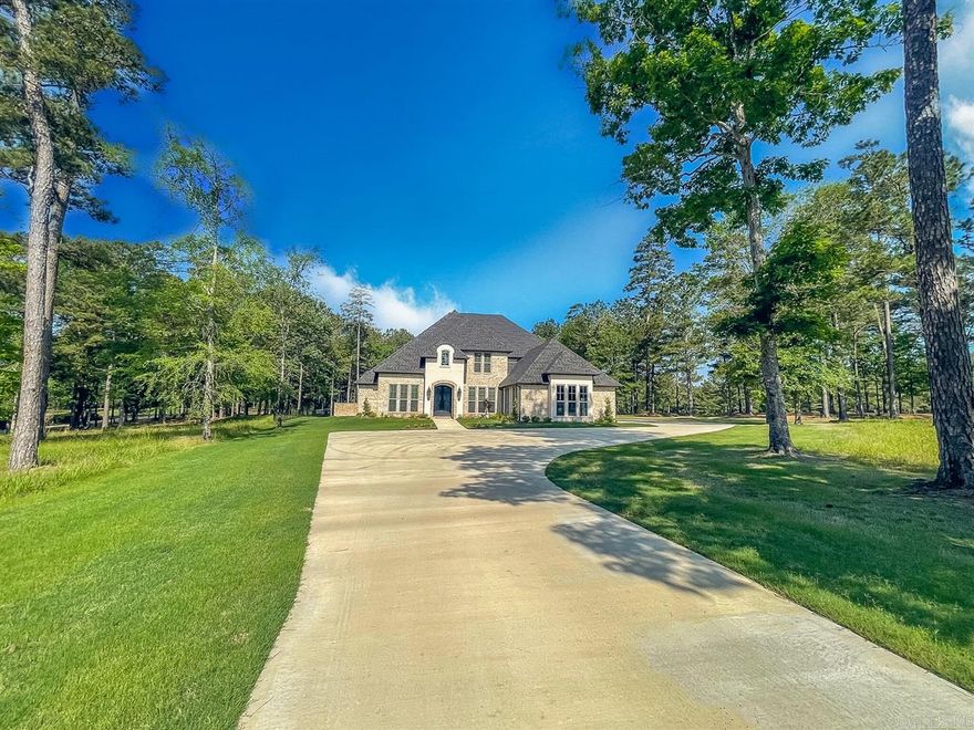 Welcome to 333 Augusta Drive, located at Arkansas #1 golf course.    Sitting on 1.22 acres with views of holes 12 and 13, this custom built home boasts over 5,000 square feet. Upon entering the custom, 9 foot double doors, you will be wowed with the expansive staircase. As you make your way in, you will pass the study and an en-suite guest bedroom, next you will enter the living room with 25 foot ceilings with plentiful natural lighting. The kitchen will not disappoint with an enormous island and Monogram appliances throughout. On the main floor, you will also find double pantries, the laundry room (which is a tornado safe room), a prep kitchen, 2 powder rooms, a den (currently being used as a playroom) and the master bedroom, with his and her vanities, a large custom shower as well as a custom walk in closet.    Once you arrive upstairs, you will find a movie theater, a guest en-suite, as well as 2 more bedrooms that share a Jack and Jill bathroom. Heading back downstairs you can enjoy your patio with fireplace any season with a built in screen that, with a press of a button, can fully enclose your patio.