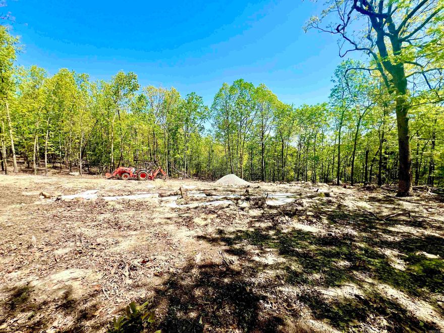 Five lots have been combined to create a little slice of heaven on 1.2 acres m/l, located 10 minutes from Mountain Home in the fabulous community of Briarcliff. This parcel is dream-home ready, with approval from the arch. review board. Foundation footings installed for a 1600 sq ft, 3 bed, 2 bath house with 2-car carport. Electrical service is active at the pole, septic is in the process of being installed. Septic permit completed. Water is ready to be hooked up at the road. Clearing and driveway are completed. Surrounded by the road on three sides, the foundation footings are located in the center of the 5 lots allowing for complete privacy and seclusion! More trees could be cleared to create a fantastic country view. Briarcliff is known for its amenities including lakes and trails, clubhouse, pool, playground, fitness center, etc. Only a short drive to Norfork Lake known for its bass, crappie and walleye fishing. Designated house plans available on American Made House Kits website.