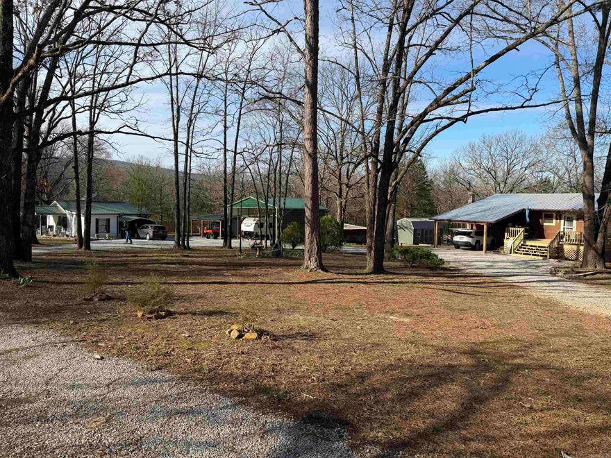 This unique property is in a great location within a short distance of the city park and the Courtsquare. It's rare to find a nice 2.87+/- acres in city limits with fencing on 3 sides. With all the work the seller has done, there's potential for multiple value streams. The improvements include: MAIN HOUSE: This house had an extensive remodel in 2024. It features 1040 sq/ft with 2BR/2BA on the main level. The walkout basement is just waiting for your imagination. It has a ductless mini split and a propane wall unit. The living room is spacious and inviting. The kitchen has white cabinets, granite counters, farmhouse sink and stainless appliances. Both bedrooms are of ample size and very comfortable. The bathrooms have new vanities, flooring and were updated during the remodel. A front porch is a perfect place for relaxing. GUEST HOUSE: This house features 708 sq/ft with 2BR/1BA. It's currently being used as a long term rental. The living area is anchored by an electric fireplace. Kitchen has a bar for extra seating and appliances, washer and dryer are included. It has a metal roof with gutters and a highly efficient ductless mini split for heating and cooling.