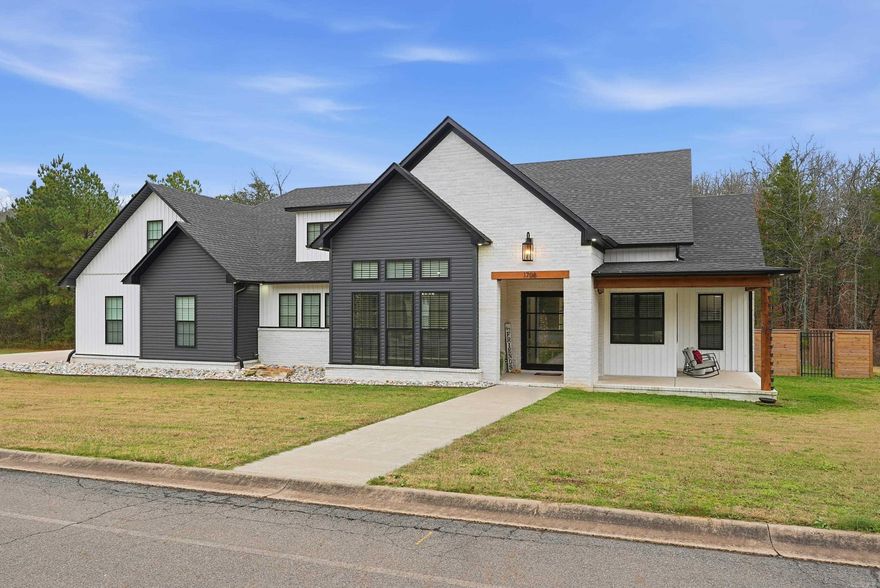 Now listed with more acreage! The lot on the garage side of the home is now included, offering excellent potential for a shop, pool house, or expanded outdoor living. Located in the exclusive gated Hidden Valley Subdivision with easy interstate access and just a 20 minute drive to Conway, this stunning 2022 custom-built home offers luxury, privacy, and convenience. The open-concept layout includes 3 bedrooms, 2 full baths, 2 half baths, an office, and a bonus room. The kitchen features an oversized 6-burner gas cooktop with griddle, double oven, double pull-out dishwasher and a refrigerator that conveys. The living room offers 11-foot ceilings and a gas-log fireplace. All bedrooms are on the main level, while the upstairs bonus room and half bath provide flexible space. The primary suite includes dual vanities, a soaking tub, walk-in shower and large walk-in closet. Enjoy year-round outdoor living on the screened-in patio with wood-burning fireplace, built-in BBQ grill and sink. Additional features include a 14x28 in-ground saltwater pool, tankless water heater, safe room, and 3-car garage. If you’re seeking luxury and privacy, this is it.