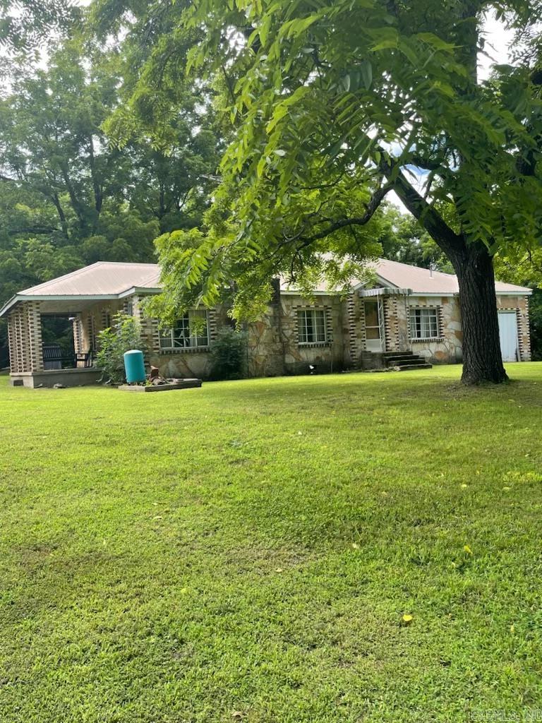 Charming Country Home Near the Buffalo National River ā Tucked beneath a canopy of mature trees, this solid and timeless country home offers a peaceful retreat just minutes from the scenic Buffalo National River. Built with classic craftsmanship, the home features unique stone and brickwork, a covered front porch perfect for rocking chairs and relaxing evenings, and a large, manicured lawn shaded by beautiful hardwoods. Inside, the house retains its rustic charm while offering modern comforts. Outside, youāll find a vintage storm cellar, a separate outbuilding, and plenty of space for gardening, hobbies, or simply enjoying the serene, natural setting. Home is offered as is.