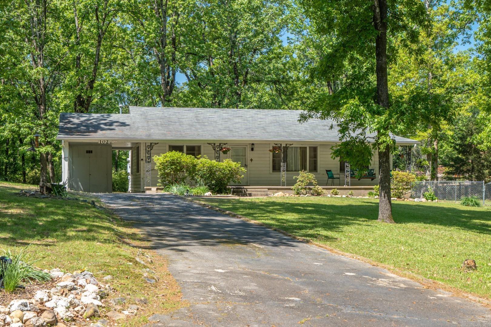 Welcome to your new oasis in the heart of Hot Springs! This charming 3-bedroom, 1-bathroom home is nestled on a picturesque .66 acre lot, boasting a prime location close to shopping, medical facilities, Oaklawn, and the golf course. As you step inside, you'll immediately be captivated by the original hardwood floors that exude timeless charm and character throughout the home. The spacious layout offers ample room for comfortable living, with three bedrooms providing plenty of space for family and guests. The sunroom offers a tranquil retreat where you can relax and soak in the natural beauty of the surrounding landscape. Step outside onto the back deck to unwind while taking in the sights and sounds of nature. Whether you're seeking adventure or simply want to enjoy the peaceful ambiance of Hot Springs, this property offers the best of both worlds, While this home boasts incredible potential, it does require some TLC to restore it to its full glory. Don't miss out on this fantastic opportunity to own a piece of Hot Springs paradise. Schedule your showing today and make this house your own!