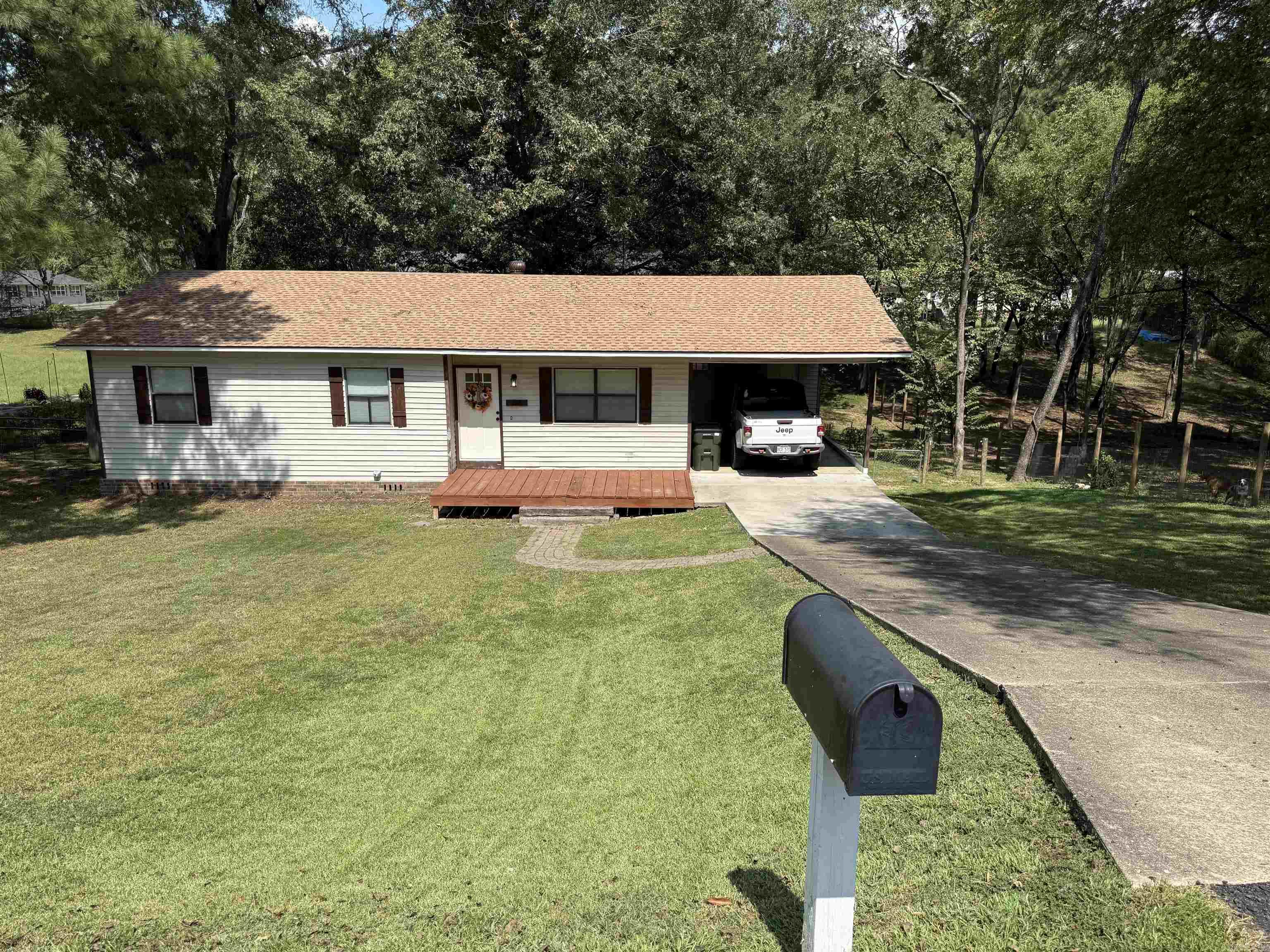 Welcome to this beautifully updated 3-bedroom, 1-bath home located within the Lakeside School District and situated on a spacious half-acre lot. The property features a fully fenced yard and has undergone numerous recent upgrades, including a new roof (2024), HVAC system (2023), fresh interior paint (2023), luxury vinyl plank flooring (2023), and new exterior doors (2024). The laundry room has been enhanced with custom shelving and cabinetry, while a new vapor barrier was installed in 2023 for added efficiency. Outdoor living is elevated with a newly built back deck (2023) and a charming wood patio in the front. Inside, the kitchen boasts all-new stainless steel appliances, offering both style and functionality. Additionally, a bathroom previously converted into a nursery can be easily restored to its original use. This move-in-ready home combines comfort, style, and practicality—schedule your private showing today to experience it firsthand.