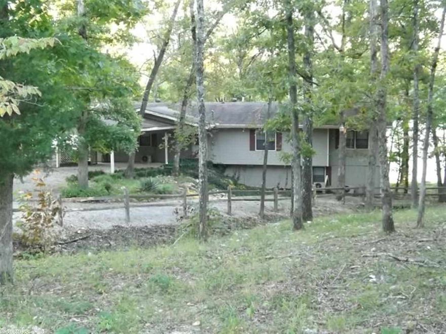 SKI LAKE COTTAGE PRICE REDUCED! Enjoy swimming from your own dock at this all-electric home with 2 bedrooms, 1 1/2 baths, family room and mud room in the basement,  2 decks, 2000 central heat and air, and native stone wood burning fireplace.  Located in a quiet Ozark Acres subdivision on the Jonesboro side of Hardy close to the clubhouse and swimming beach. Priced to sell with water sports lovers in mind.