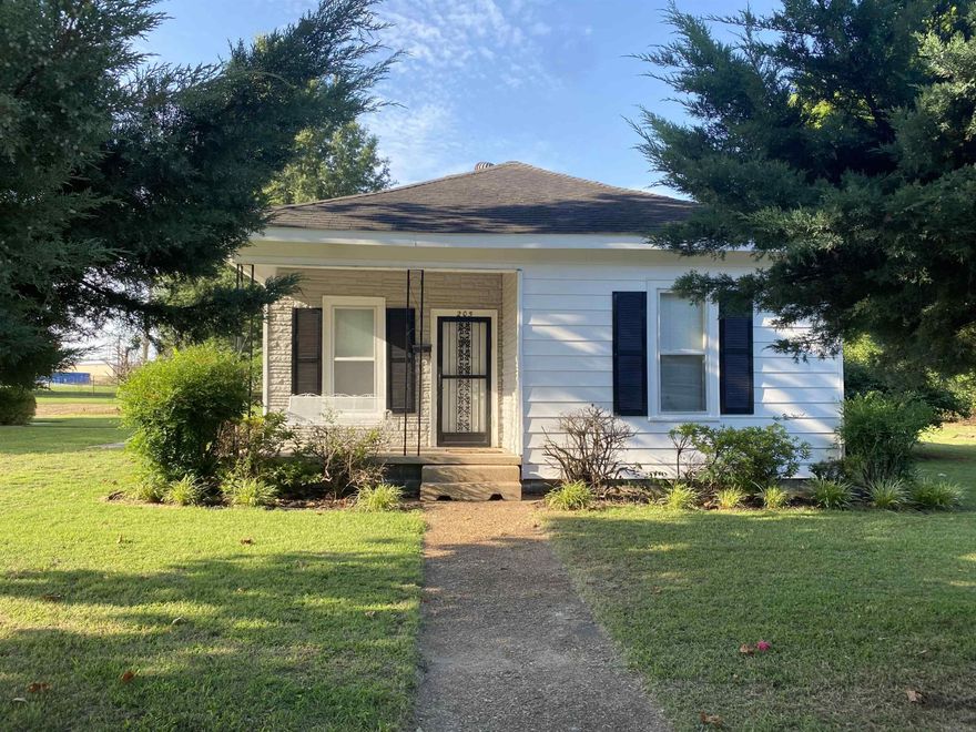 Cash or in house bank only, call agent. Nice curb appeal! 2 bedroom, 1 bath home on over half an acre with combo workshop/garage which measures about 36' x 36'. The shop has electric and 2 overhead doors, so it could function well as a detached garage. Any loan type should work for this property, it has been well maintained. The kitchen appliances all stay and kitchen has been updated over the years. There is pantry and office space, as well as a laundry room. The water heater is newer. A side walk runs from the patio around to the back of the house with nice perennials planted along side.