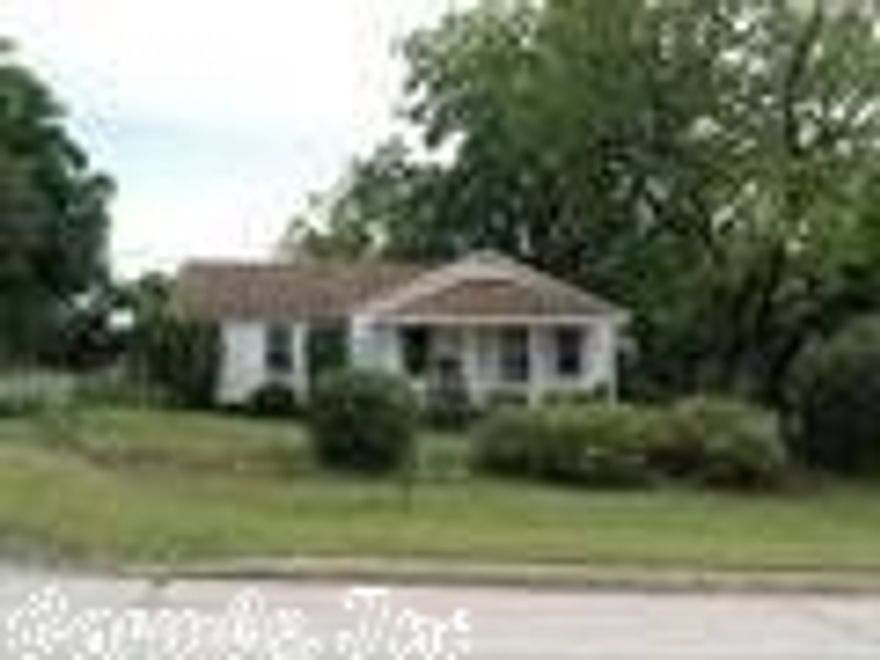 View the beautiful landscaping all around this 2 bedroom, 1 bathroom home.  One of the bedrooms has built in shelving and a computer desk.  Lots of extras to enjoy, and two huge pecan trees that supply a lot of pecans for yummy pecan pie.  The back porch comes from the parking area with steps and a ramp.  There is a well that is currently not used but has running water.  The kitchen was designed with a lot of cabinets and a eating bar on the side.  The dining area is open to the kitchen.