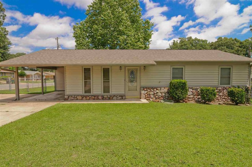 This 4 bedroom home sits on a corner lot with a circle drive. Very close to shopping & schools.  It has an open living/dining area.  Laminate wood flooring, siding, roof & windows are only a few years old.  Fully fenced backyard with a covered deck.  See it today!