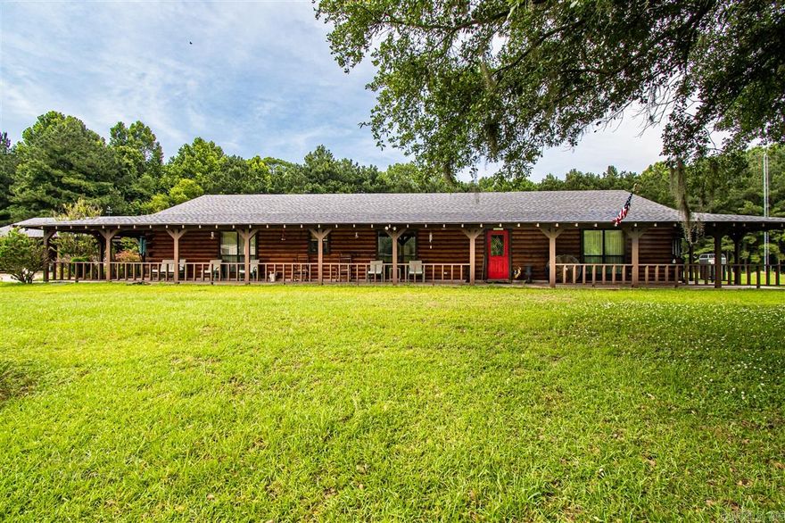 Beautiful Log home right outside of El Dorado sitting on 62 acres. This property has an automatic gate closing off its private driveway to the public road, covered wrap around porch, storage building behind the house, and a large 60x40 shop with dual roll up doors. There is a connected 19.95 acre tract of land that can be sold with the property which would give the buyer a total of 82.21 acres. Give me a call to schedule a showing.