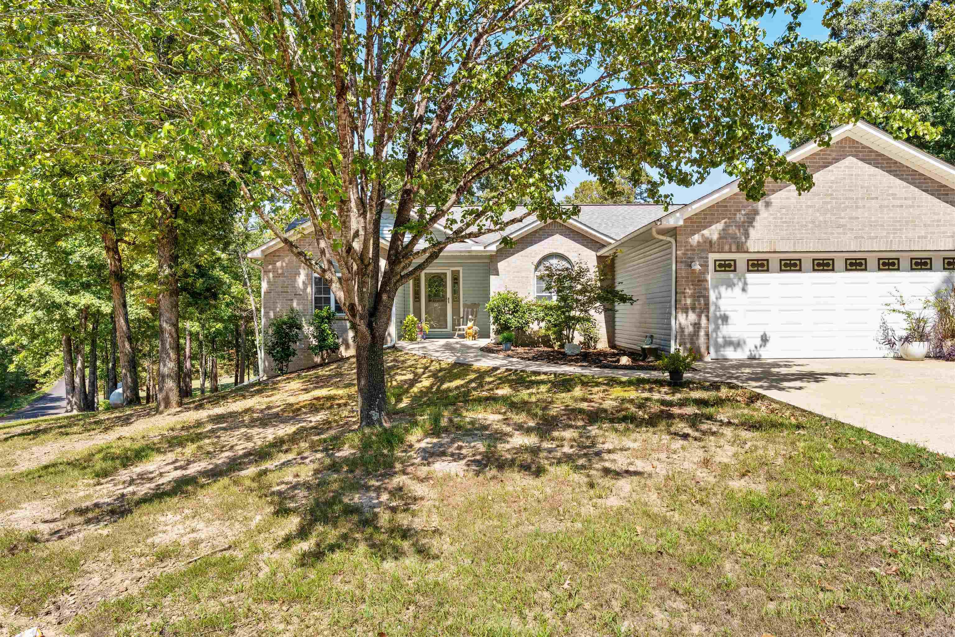 This 4-bedroom, 3-bath home sits on a corner lot with beautiful lake views - fewer than 2 min. from the water. With a new dishwasher, HVAC less than 2-yrs old, and abundant storage, it's move-in ready for lake life. The open layout is great for family and friends, while the versatile lower level offers great Airbnb or guest suite potential. Perfect as a full time home, weekend retreat, or investment at Greers Ferry Lake!