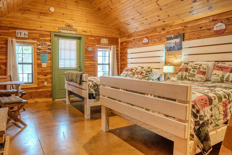 Discover an exceptional turnkey campground opportunity in the heart of the Ozark Mountains. This proven, income-producing property sits on 8 scenic acres surrounded by thousands of acres of St. Francis National Forest and Sylamore WMA, drawing guests from across the country for hunting, hiking, floating, and endless outdoor recreation. With over 10 years of established success and repeat clientele, this property offers a rare chance to step into a thriving business with room to expand.   The campground features 5 beautifully crafted custom log cabins, 5 full-service RV sites with 50-amp hookups and dump station, custom bathhouses, rural water, internet, and septic systems already in place. A centrally located office includes a manager’s living quarters and wash room. Guests enjoy a covered pavilion with BBQ area, easy access to top attractions, and proximity to the White River, Norfork Lake, Buffalo National River, and Blanchard Springs Caverns.  A picturesque blend of convenience, charm, and proven performance—your next great investment awaits.