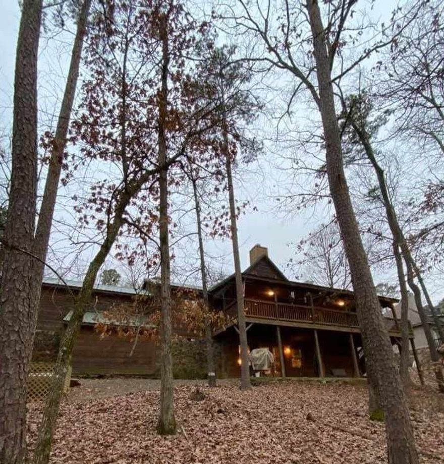 Welcome to the market this beautiful Southern land log cabin home. Lake front lake view in Tannenbaum. 3 bedroom 2.5 bath room with a 2nd living room down stairs. Beautiful real wood pine flooring, sheet rock walls, rustic meets modern design w Vaulted living room exposed beams, sun room for those cold days, two decks for out door enjoyment.2 car Garage w epoxy floors, choose what deck to drink your coffee in the morning and enjoy the lake. Please call for your showing today.