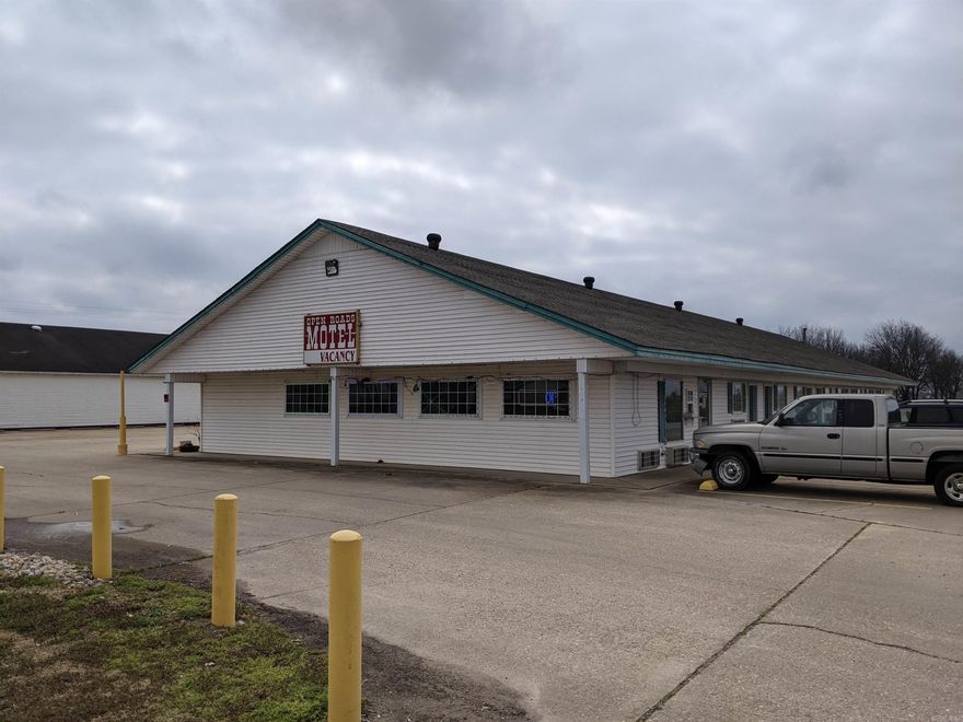 If you are looking for a good investment opportunity this one could be for you. This motel is turnkey and ready for its new owner to take over! This motel has 25 rooms, and each is equipped with its own microwave and refrigerator. There is a laundry room and storage room for ease of cleaning and storing items away from the main living quarters. The "shared area" is covered with an awning and has picnic tables for enjoying the outside space. All units have concrete parking and there are even 4 rv sites on the property, with underground electric if hook up or just parking is needed. The main living quarters are at the front of the motel, and it is conveniently located within walking distance to a few restaurants and the grocery store. All supplies and office equipment are included with the property and financials are available upon request. Call today to schedule your appointment!
