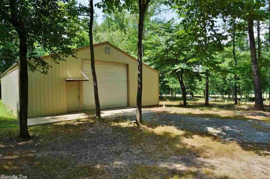 Unique property, many possibilities,  is just 2 miles from Lobo's landing on the Little Red River. This 3.1 acre tract comes equipped with a 39'x39' metal building, which is divided into a 1BR, 1BA living area with central heat/air, kitchen, laundry hookups, and wiring for TV and internet; with the remaining 27'x39' area left as a shop with 18' ceilings at the highest peak and 2 commercial-sized garage doors. All utilities are underground, 1,000 gallon septic already has t-off for a new home, if desired.