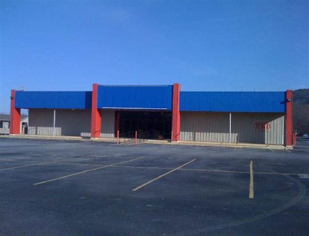 Former National Home Center, perfect for another hardware/lumber yard or new use.  Over 300' of Hwy 25B front footage with back 5 acres fully fenced with security fence.  Contains 3 buildings (includes concrete bldg next door) and several 3 sided bays.  Entire property is concreted and black topped.  Retail space contains 16K sq. ft. with ample office space and climate controlled storage.  Possible lease.