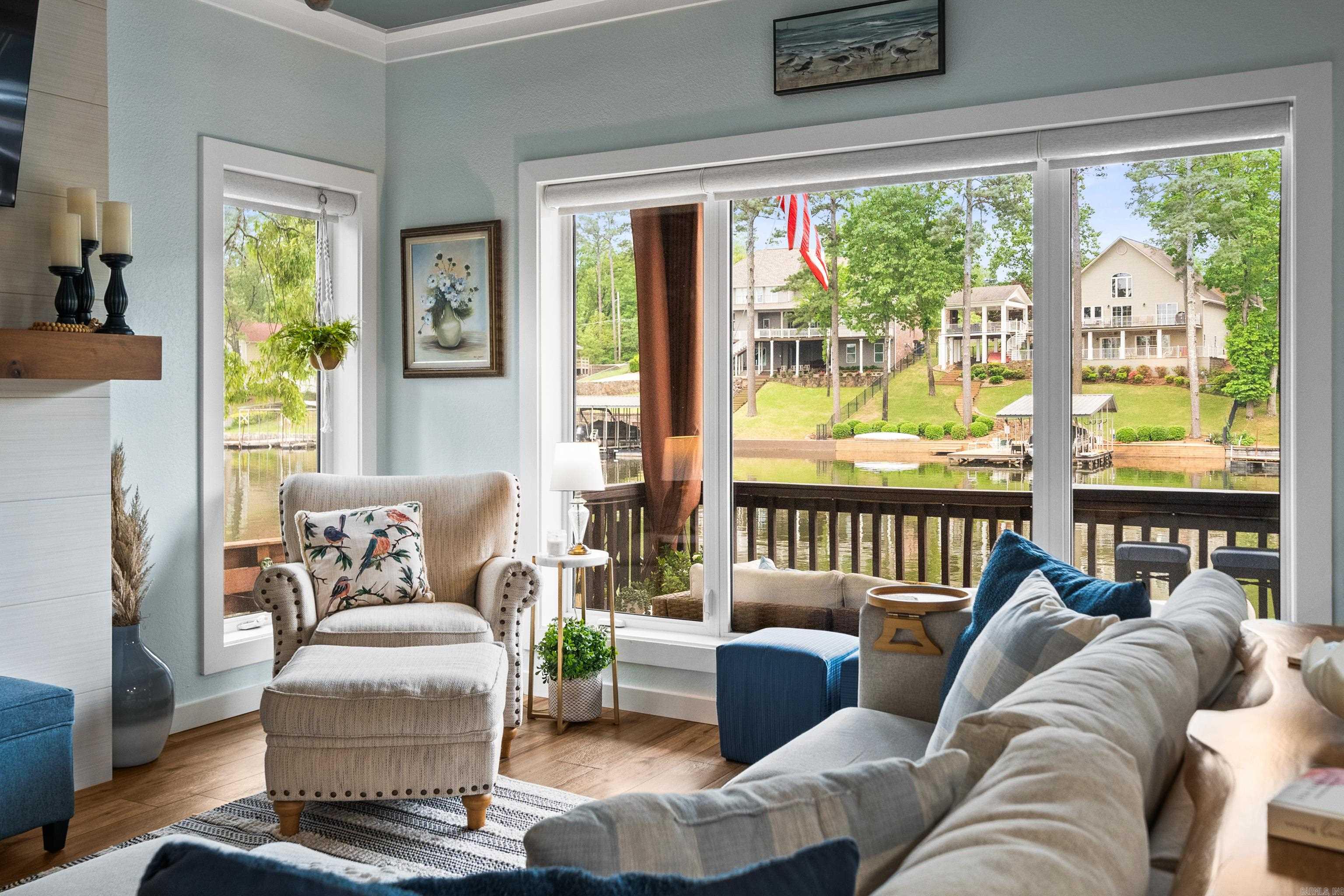 Every inch of this beautifully updated Lake Hamilton condo has been carefully renovated with high-end finishes and thoughtful touches throughout. Just steps from the water, youāll walk in the front door and immediately feel right at home in a space that perfectly balances modern comfort with relaxed lakefront vibes. The open living and kitchen area is filled with natural light thanks to large windows that showcase stunning views of the lake. Thereās a cozy electric fireplace for chilly evenings and powered curtains you can adjust with the touch of a button. The kitchen is as stylish as it is functional, featuring Whirlpool appliances, a Bosch dishwasher, and sleek finishes that tie it all together. The primary suite feels like a personal retreat, complete with a spacious walk-in closet custom outfitted with built-in shelving, shoe racks, and drawer storage. The bathroom has a spa-like feel, with an oversized tile shower and a wall-mounted towel warmer that adds a touch of everyday luxury. Even the stackable washer and dryer have their own hidden spaceātucked neatly behind a powered curtain for easy access without sacrificing style. STR not allowed.